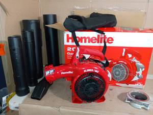 lot 13 image: 150 MPH 400 CFM 26cc Gas Handheld Blower Vacuum by Homelite- slightly used