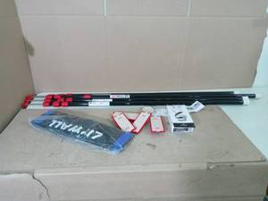 lot 82 image: ZP4 Contains 4 10 ft. Steel Spring Loaded Poles & accessories - open box not used