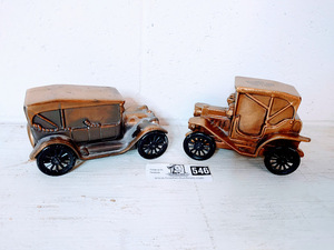 lot 546 image: Two Copper 1900s Dodge Car Piggy Banks