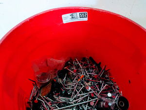 lot 552 image: Harbor Freight 5 gallon Bucket Half Full with Nails and More
