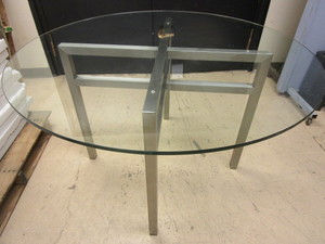 lot 505 image: TABLE, WITH BRUSHED SILVER BASE AND GLASS TOP