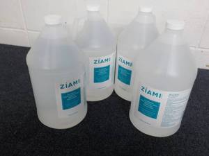 lot 187 image: 3 and a partial Gallon Jugs Ziami A...