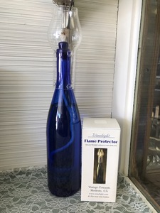 lot 64 image: Blue Bottle Oil Lamp