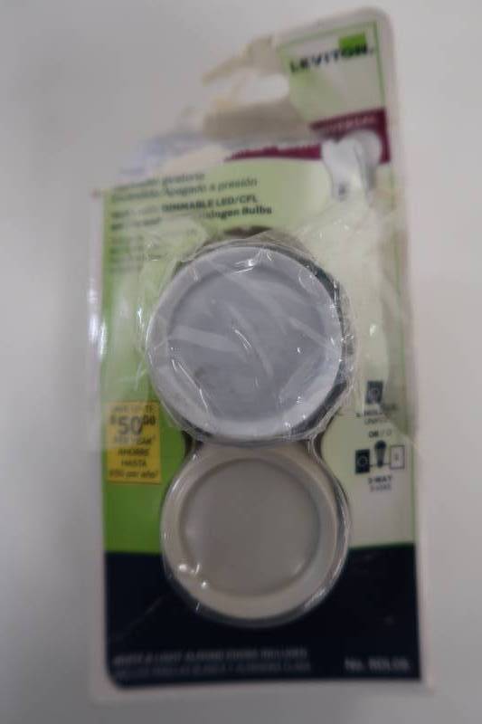 lot 49 image: Leviton Trimatron 600-Watt Single-Pole3-Way Universal Push OnOff Rotary Dimmer, WhiteLight Almond