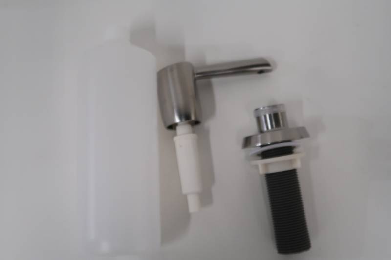 lot 53 image: Delta Essa Deck Mount Metal Soap Dispenser in Arctic Stainless
