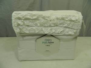 lot 12 image: New Posh Home 4 Piece Ruffled Queen Sheet Set