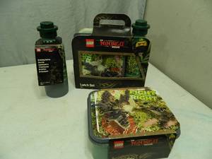 lot 173 image: New Lego Ninjago The Movie Lunch Boxes and Water Bottles