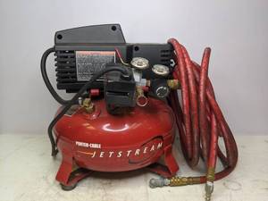 lot 5 image: Porter Cable Jetstream 4 Gallon Pancake Air Compressor