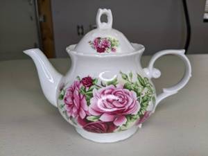 lot 325 image: Porcelain Tea Pot with Rose Motif