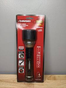 lot 213 image: Brand New Husky 1000 Lumens LED Virtually Unbreakable Aluminum Flashlight