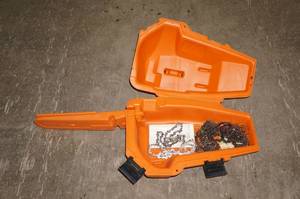 lot 27 image: Empty Stihl Chain Saw Case with Chains