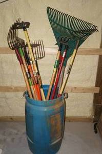 lot 95 image: Barrel of Rakes, Hoes, Forks