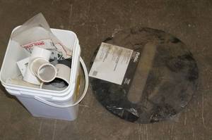 lot 172 image: Sump Basin Lid and Bucket of PVC Fittings