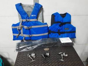 lot 19 image: Adult & Child Size Life Vests, VW Cargo Kit, 3- Fishing Reels (1-Quantum & 2-Shakespeare)