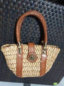 lot 26 image: Michael Kors Straw Handbag