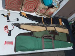 lot 41 image: Lot Of Assorted Gun CasesSocks & 2-Sling Shots