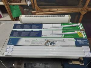 lot 46 image: 3-4 Ft. Fluorescent Light Fixtures & 2 Packs Of 2 New Bulbs In Packaging. Also 1-Electric Heater