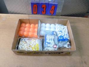 Flat of golf accessories. As shown.