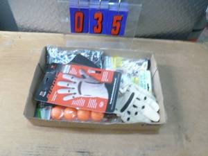 Flat of golf accessories. As shown.