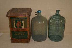 lot 36 image: 2 Blue Tinted Glass 5 Gallon Water Jugs