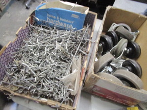 lot 317 image: BOX OF WHEELS, PEG BOARD HOOKS AND DRAWER SLIDES