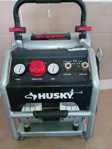 lot 18 image: 4.5 Gal. Portable Electric-Powered Silent Air Compressor by Husky- used -SEE PICTURES