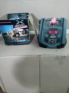 lot 45 image: Battery Extender 12-Volt 1,200 Amp Battery Jump Starter by Schumacher- open box not used -SEE PICTURES