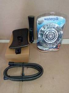 lot 92 image: 4-spray 9 in. Shower Head and Handheld Shower Head in Antique Bronze by AKDY & 7-Spray 7 in. Single Wall Mount Shower Head in Chrome by Waterpik- open box not used SEE PICTURES
