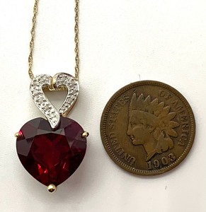 lot 19 image: Lovely Cr Ruby (6.65 CTW) Heart Pendant Necklace w10 Diamond Chips in 10K Yellow Gold, Original Tag