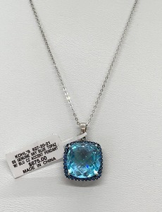 lot 4 image: Genuine Large Sky Blue Topaz Necklace w Blue CZ Accents, Set In Sterling Silver on 18 Chain,  Original Tag
