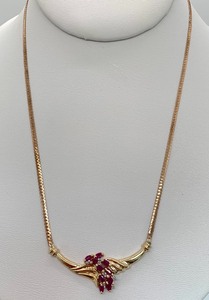 lot 27 image: 10K Gold Chevron Necklace w 10 Rubies6 Diamonds, Original Tag