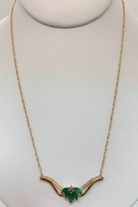 lot 31 image: 10K Gold Chevron Pendant Necklace w (Assumed) Emeralds on 10K Chain