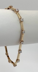 lot 2 image: 10K Yellow Gold Diamond Bracelet (15 Diamonds, 14 TCW) - 7 Long,  Original Tag