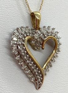 lot 56 image: Assumed Diamond Heart Necklace (.5 CT TW) w Round Stones and Baguettes in 10K YG, 19.5 Chain, Orig. Tag