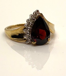 lot 82 image: 10K Yellow Gold Ring wLarge Teardrop Deep Red Stone w 6 Side Chips, Size 6-34