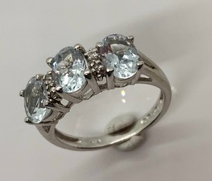 lot 84 image: 10K White Gold Ring w 3 Oval, Icy Pale Stones and 4 White Stone Chips, Size 7