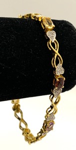 lot 125 image: Gold Over Sterling Silver Boxed Bracelet w Stones of Assorted Colors, 7.25 Long, Orig. Tag