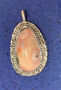 lot 132 image: Sterling Silver Setting of Interesting Natural Pink Stone Pendant