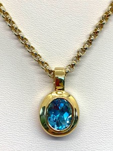 lot 136 image: Genuine Blue Topaz Oval Necklace In Gold over Sterling Silver Setting on a Chunky 18Chain, Original Tag