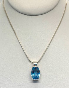 lot 151 image: Oblong (Assumed) Blue Topaz Pendant on 18 Rounded Cord Chain, On Original Card