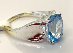 lot 155 image: Sterling Silver Ring w Large Oval Genuine Blue Topaz, Size 7, Orig. Tag