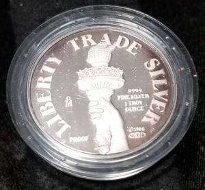 lot 37-A image: 1 TROY OZ. .999 FINE SILVER LIBERTY TRADE ROUND IN ORIGINAL PACKAGING