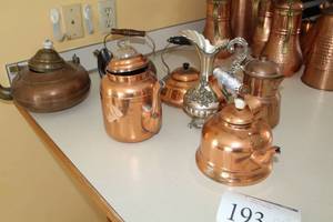 lot 193 image: Lot of (7) Kitchen Accessories - Copper Tea Pots (x6), Silver Pitcher (x1)