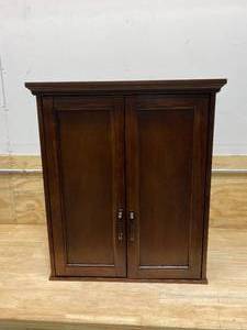 lot 92 image: HOME DECORATORS COLLECTION Ashburn 23-12 in. W Bathroom Storage Wall Cabinet in Mahogany