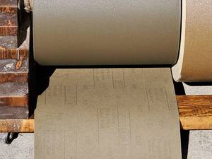 lot 127 image: (2) Large Rolls Wet or Dry Sand Paper on a Rolling Stand