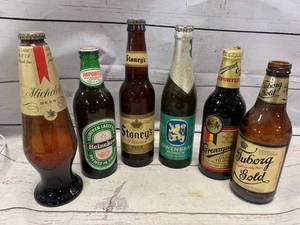 lot 76 image: Lotof6 Vintage Beer Bottles(no ship)