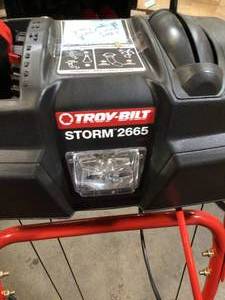 26 in. 243 cc 2-Stage Gas Snow Blower with Electric Start Self Propelled and 1-Hand Operation by Troy-Bilt in good conditions