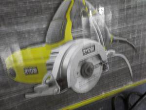 Ryobi Hand Held 4 Tile Saw, powers...