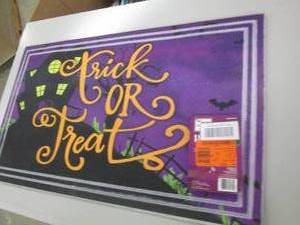 lot 15 image: tick or treat door mat ...