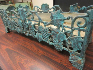 DECORATIVE WROUGHT-IRON PLANT HOLDER